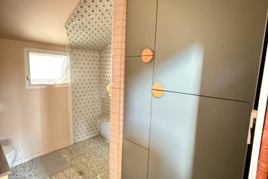 Bathroom - small eclectic master beige tile and glass tile terrazzo floor, multicolored floor, single-sink and vaulted ceiling bathroom idea in Toronto with flat-panel cabinets, beige cabinets, a one-piece toilet, a vessel sink, a niche and a floating vanity