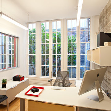 Modern Loft Home Office with Exposed Concrete Walls