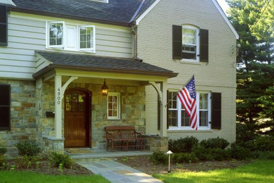Large elegant beige two-story mixed siding exterior home photo in DC Metro with a shingle roof