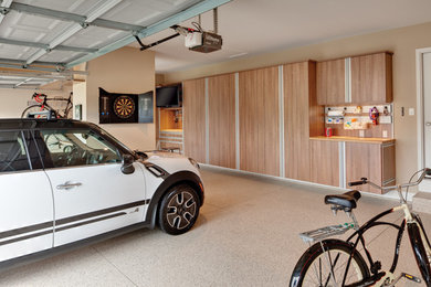 Large transitional attached two-car garage workshop photo in Austin