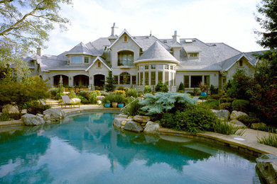Example of a huge classic gray three-story mixed siding exterior home design in Sacramento with a hip roof