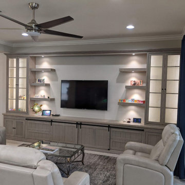Custom Entertainment Center with Sliding Barn Doors and 6 Floating Shelves