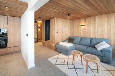 Idées déco pour un salon montagne avec un plafond en lambris de bois et du lambris de bois.