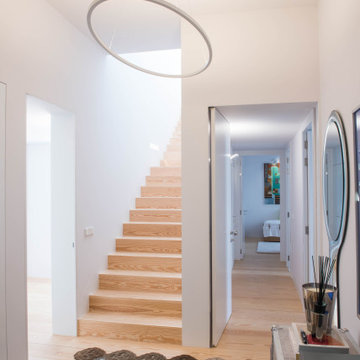 Stair Hall with Patterned Runner and Artwork