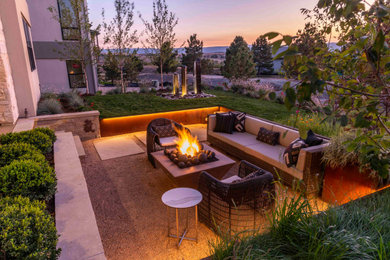 Small trendy backyard stone patio photo in Denver