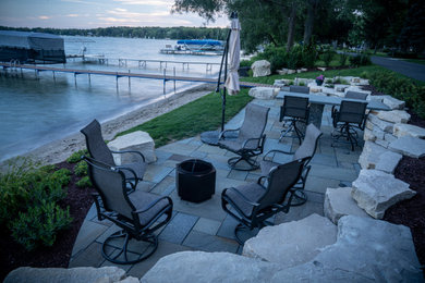 Example of a mountain style patio design in Milwaukee