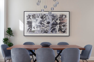 Dining room - large contemporary brown floor dining room idea in San Francisco with beige walls