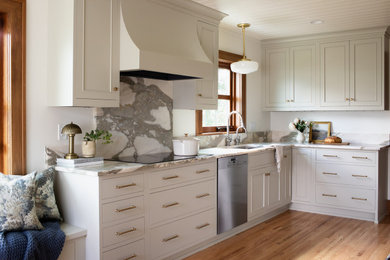 Inspiration for a mid-sized timeless light wood floor and wood ceiling kitchen remodel in Other with an undermount sink, beaded inset cabinets, marble countertops, marble backsplash, stainless steel appliances and white countertops
