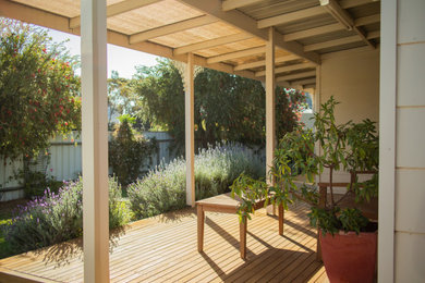 This is an example of a country front yard verandah in Other.