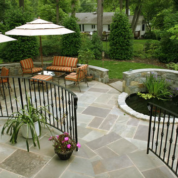 Multi-Level Flagstone Patio with Fieldstone Retaining Walls and Water Feature
