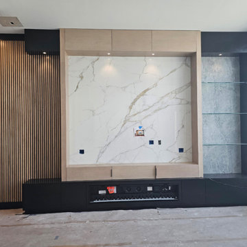 Custom Built-In Modern Entertainment Center with Wood Slatted Wall and Fireplace