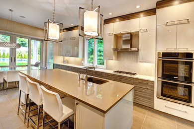 Inspiration for a mid-sized contemporary galley ceramic tile eat-in kitchen remodel in New York with flat-panel cabinets, quartz countertops, stainless steel appliances, an island, white cabinets, an undermount sink, beige backsplash and ceramic backsplash