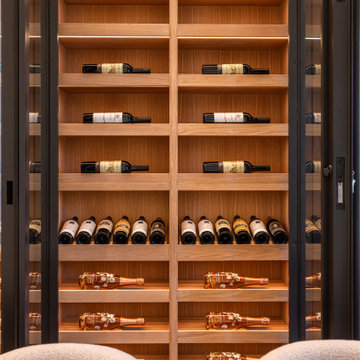 Luxury Modern Wine Wall Display with White Oak Cabinetry and Integrated LEDs