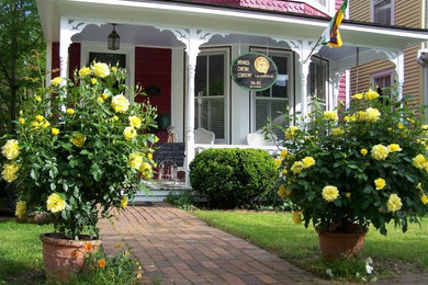 Inspiration for a mid-sized timeless red two-story wood exterior home remodel in Richmond with a shingle roof