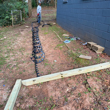 Slate rock driveway and slate rock walkway to the basement.