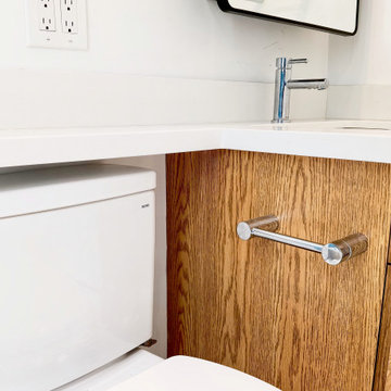 Side-Mounted Chrome Paper Holder on a Wood Vanity | High Park Toronto
