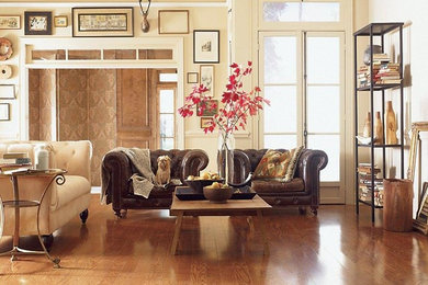 Inspiration for a large transitional open concept living room in New York with medium hardwood floors, beige walls, no fireplace and brown floor.