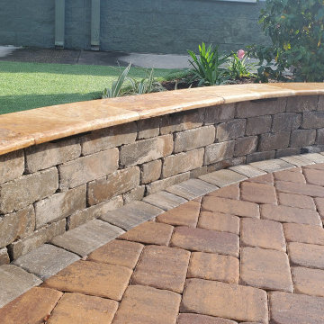 Pond Waterfall, Seating Wall, Travertine cap, and artificial turf