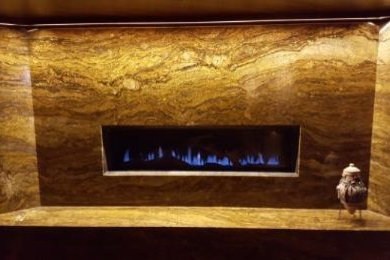 Inspiration for a rustic family room remodel in Other with a stone fireplace