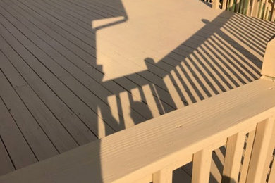 Deck - large traditional backyard ground level wood railing deck idea in Detroit with no cover