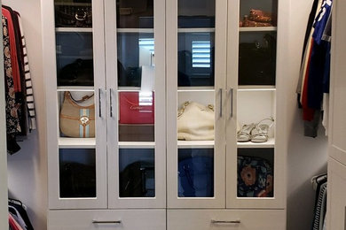 Walk-in closet - large transitional gender-neutral carpeted and beige floor walk-in closet idea in Indianapolis with shaker cabinets and white cabinets