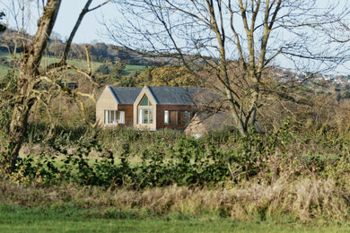 Inspiration for a farmhouse house exterior in Other.