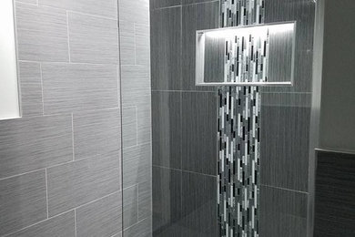 Inspiration for a mid-sized contemporary 3/4 gray tile and porcelain tile porcelain tile and gray floor bathroom remodel in Chicago with gray walls