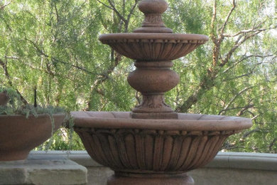 Small tuscan brick porch photo in Orange County with a roof extension