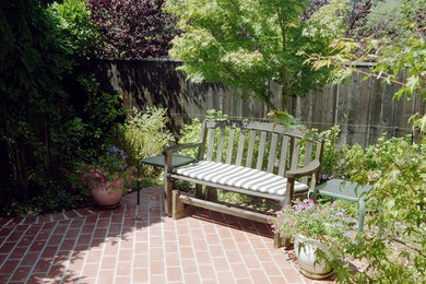 Elegant brick patio photo in San Francisco with no cover