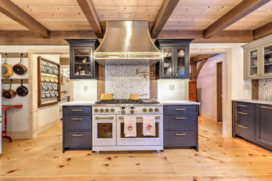 Eat-in kitchen - large l-shaped light wood floor and exposed beam eat-in kitchen idea in Other with a farmhouse sink and white appliances