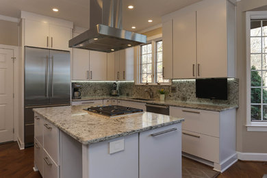 Design ideas for a large modern u-shaped separate kitchen in Raleigh with an undermount sink, flat-panel cabinets, white cabinets, quartz benchtops, grey splashback, stainless steel appliances, light hardwood floors and with island.