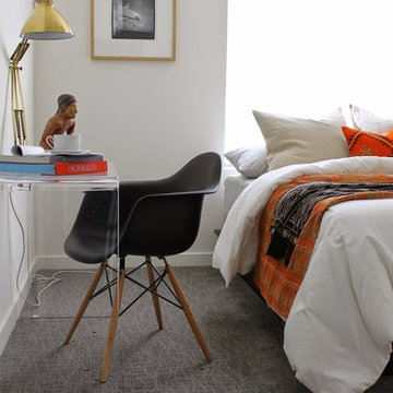 Modern Bedroom with Lucite Desk and Orange Kilim Pillow