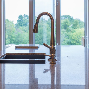 Falsetta - Brown Cabinets with Mosaic Tile Backsplash