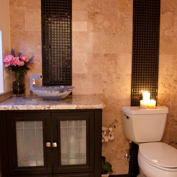 Stone Bath with Black Mosaic Accents