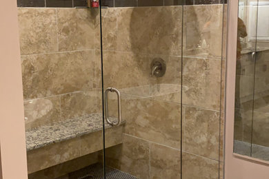 Bathroom - mid-sized modern master beige tile and glass sheet porcelain tile, beige floor, double-sink and vaulted ceiling bathroom idea in Atlanta with shaker cabinets, white cabinets, a two-piece toilet, beige walls, a drop-in sink, granite countertops, a hinged shower door, beige countertops and a freestanding vanity