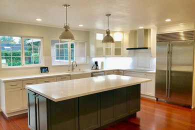 Example of a minimalist kitchen design in San Francisco with an island