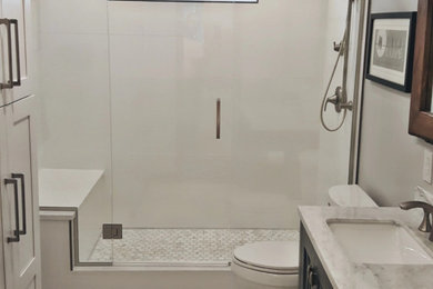 Large elegant porcelain tile and multicolored tile marble floor, multicolored floor and double-sink bathroom photo in Other with a two-piece toilet, an undermount sink, a hinged shower door, raised-panel cabinets, gray cabinets, gray walls, marble countertops, multicolored countertops and a freestanding vanity