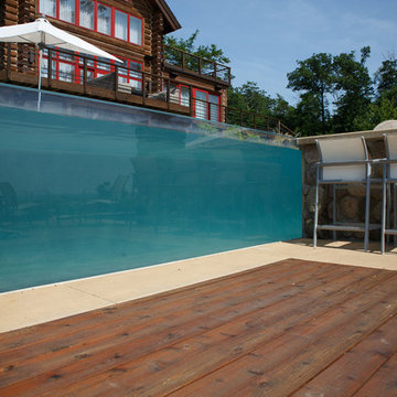 Modern pool, spa and landscape on lakeshore