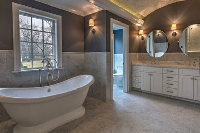 Inspiration for a timeless gray tile and marble tile marble floor, gray floor, double-sink and vaulted ceiling bathroom remodel in New York with shaker cabinets, white cabinets, marble countertops, gray countertops and a built-in vanity