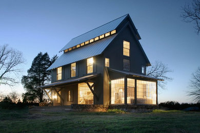 Example of a mid-sized country gray two-story wood house exterior design in Charlotte with a metal roof