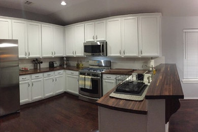Inspiration for a timeless bamboo floor and brown floor kitchen remodel in Dallas with beaded inset cabinets, copper countertops, beige backsplash, ceramic backsplash and beige countertops