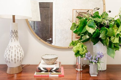 Mid-sized transitional dark wood floor and brown floor entryway photo in New York with white walls and a white front door