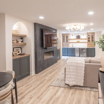Warm & Inviting Basement Retreat with Custom Bar + Entertainment Center