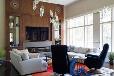 Large eclectic open concept dark wood floor, brown floor and tray ceiling living room photo in Tampa with a ribbon fireplace, a tile fireplace and a wall-mounted tv