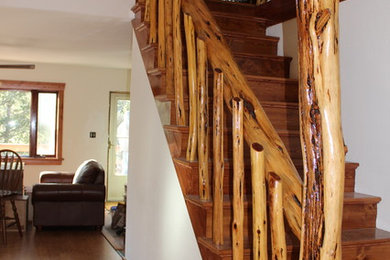 Example of a mid-sized mountain style wooden straight wood railing staircase design in Albuquerque with wooden risers