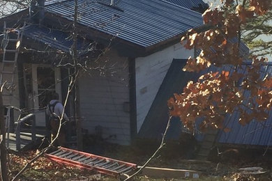 Inspiration for an exterior home remodel in Oklahoma City with a metal roof