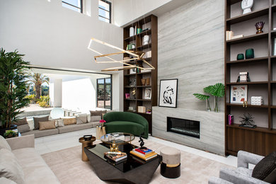 Inspiration for a large contemporary formal and open concept porcelain tile and beige floor living room remodel in San Diego with beige walls, a standard fireplace, a stone fireplace and no tv