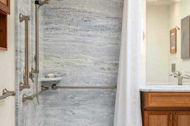 Bathroom - large contemporary master single-sink bathroom idea in Seattle with medium tone wood cabinets and a wall-mount toilet