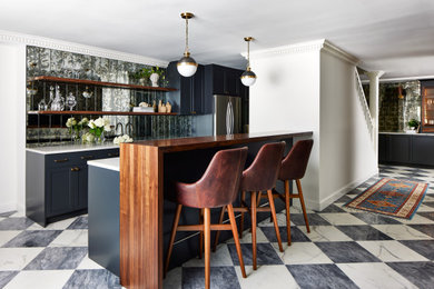 Mid-sized elegant l-shaped cement tile floor and white floor open concept kitchen photo in DC Metro with an undermount sink, shaker cabinets, blue cabinets, metallic backsplash, stainless steel appliances, an island and white countertops