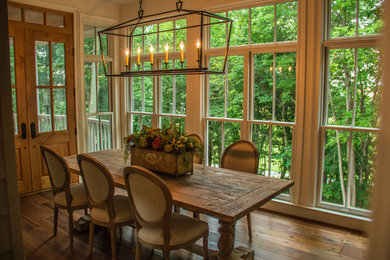 Example of a transitional dining room design in Other
